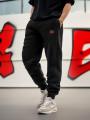 Spodnie Dresowe Męskie Czarne Jigga Wear Frame Name