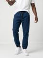 Spodnie Jeansowe Jogger Męskie Ciemne Niebieskie Jigga Wear Leather Patch