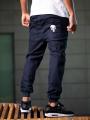 Spodnie Jeansowe Jogger Męskie Ciemne Niebieskie Marvel Promo Punisher Small Logo
