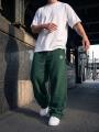 Spodnie Dresowe Baggy Męskie Zielone Jigga Wear Haft Logo Drawcord