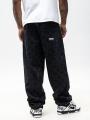 Spodnie Jeansowe Extra Baggy Męskie Czarne Sprane Mass Monogram