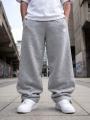 Spodnie Dresowe Baggy Męskie Ciemne Melanżowe Jigga Wear Logo Drawcord