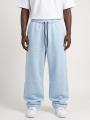 Spodnie Dresowe Baggy Męskie Jasne Niebieskie Jigga Wear Logo Drawcord