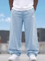 Spodnie Dresowe Baggy Męskie Jasne Niebieskie Jigga Wear Logo Drawcord
