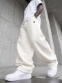 Spodnie Dresowe Baggy Męskie Kremowe Ecru Jigga Wear Logo Drawcord