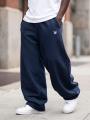 Spodnie Dresowe Baggy Męskie Ciemne Niebieskie Jigga Wear Logo Drawcord